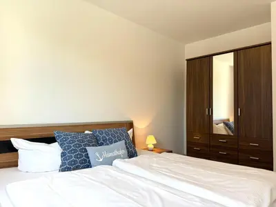 Ein Bett oder Betten in einem Zimmer der Unterkunft Haus am Waldbad Whg 3