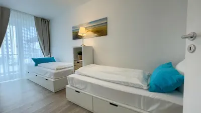 Ein Bett oder Betten in einem Zimmer der Unterkunft Nordseebrandung B1 1