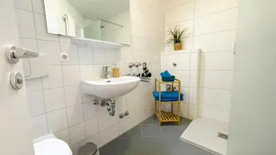 Ein Badezimmer in der Unterkunft Nordseebrandung B1 1