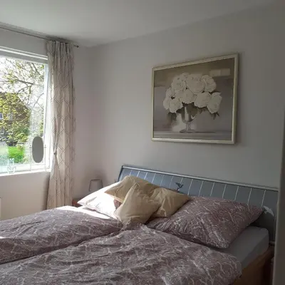 Ein Bett oder Betten in einem Zimmer der Unterkunft Bi uns im Norden