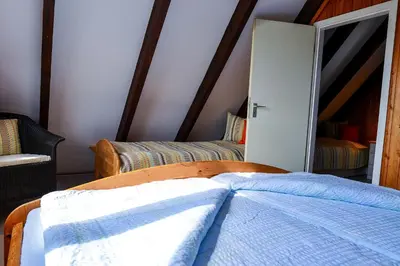Ein Bett oder Betten in einem Zimmer der Unterkunft Haus Am Ringwall R84C