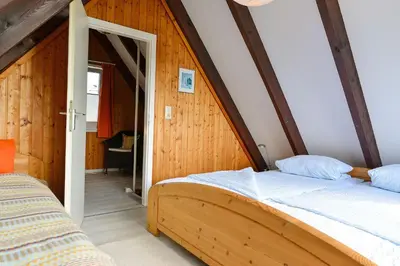 Ein Bett oder Betten in einem Zimmer der Unterkunft Haus Am Ringwall R84C