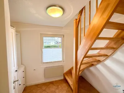 Ein Bett oder Betten in einem Zimmer der Unterkunft Ferienhaus Seepferdchen Duhnen