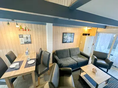 Ein Sitzbereich in der Unterkunft Ferienhaus Am Ringwall 112a Duhnen