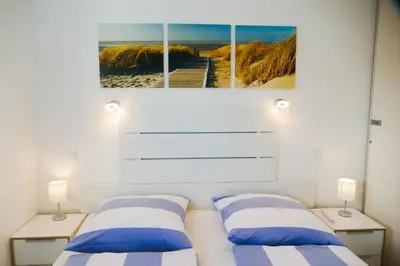 Ein Bett oder Betten in einem Zimmer der Unterkunft Am Sahlenburger Strand AS01