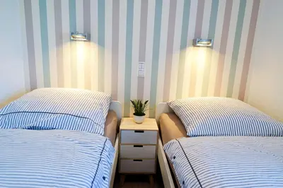 Ein Bett oder Betten in einem Zimmer der Unterkunft Am Sahlenburger Strand AS06
