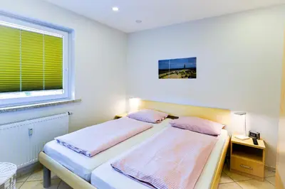 Ein Bett oder Betten in einem Zimmer der Unterkunft Am Sahlenburger Strand AS10