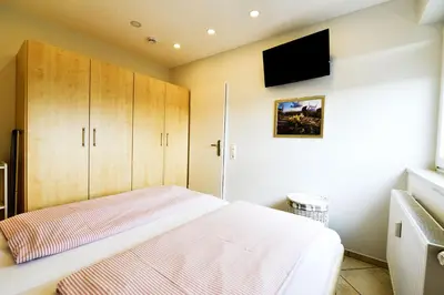 Ein Bett oder Betten in einem Zimmer der Unterkunft Am Sahlenburger Strand AS10