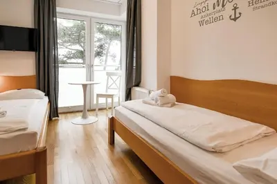 Ein Bett oder Betten in einem Zimmer der Unterkunft Strandpalais PA07