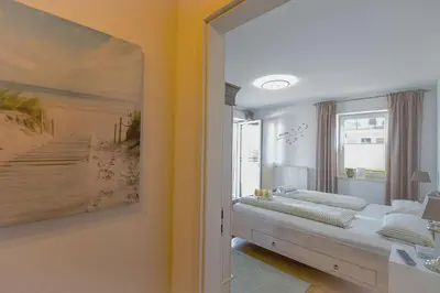 Ein Bett oder Betten in einem Zimmer der Unterkunft Strandpalais PA07