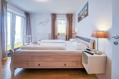 Ein Bett oder Betten in einem Zimmer der Unterkunft Strandpalais PA07