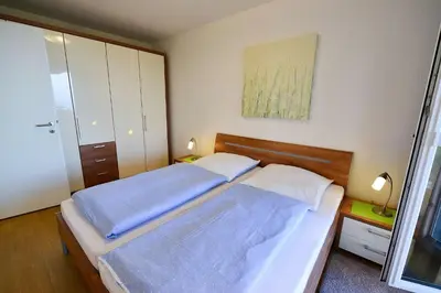 Ein Bett oder Betten in einem Zimmer der Unterkunft Strandpalais PE08
