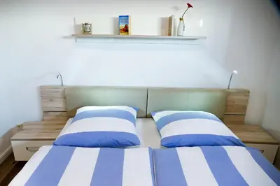Ein Bett oder Betten in einem Zimmer der Unterkunft Am Sahlenburger Strand AS18