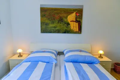 Ein Bett oder Betten in einem Zimmer der Unterkunft Am Sahlenburger Strand AS19