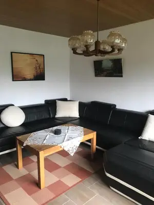 Ein Sitzbereich in der Unterkunft Ferienhaus am Heringskoop