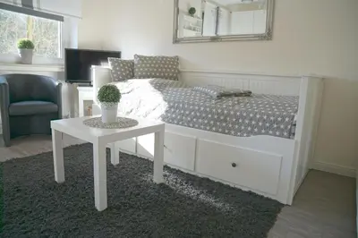 Ein Bett oder Betten in einem Zimmer der Unterkunft Apartmenthaus Frauenpreiss FeWo 61