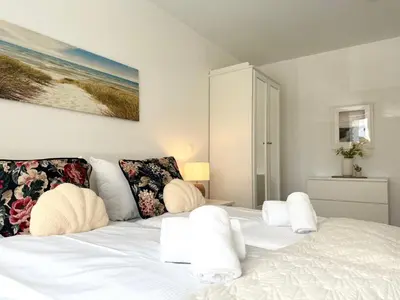 Ein Bett oder Betten in einem Zimmer der Unterkunft Nordseebrandung A3 1