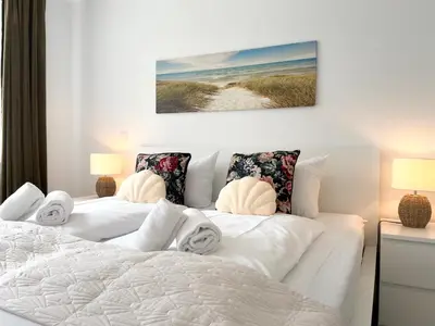 Ein Bett oder Betten in einem Zimmer der Unterkunft Nordseebrandung A3 1