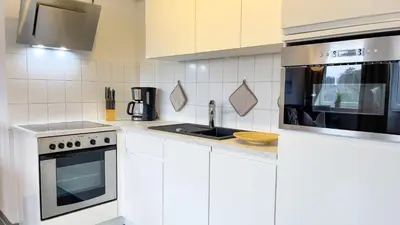 Küche/Küchenzeile in der Unterkunft Nordseebrandung B2 2