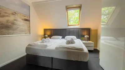Ein Bett oder Betten in einem Zimmer der Unterkunft Leuchtfeuer 4