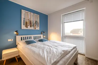 Ein Bett oder Betten in einem Zimmer der Unterkunft 5 Sterne Penthouse Strandsuite