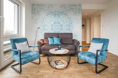 Ein Sitzbereich in der Unterkunft 5 Sterne Penthouse Strandsuite
