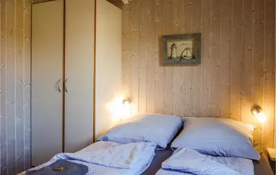 Ein Bett oder Betten in einem Zimmer der Unterkunft Awesome Home In Otterndorf With Sauna