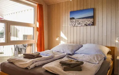 Ein Bett oder Betten in einem Zimmer der Unterkunft Beautiful Home In Otterndorf With Sauna