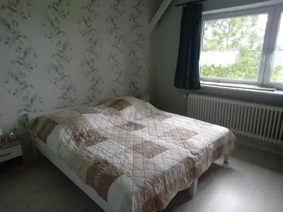 Ein Bett oder Betten in einem Zimmer der Unterkunft Ferienwohnung Wremen