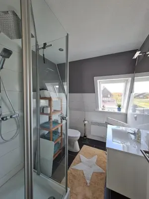 Ein Badezimmer in der Unterkunft Ferienhaus Kleine Robbe