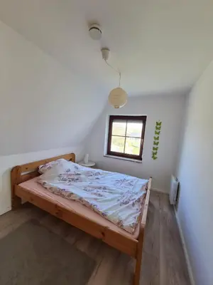Ein Bett oder Betten in einem Zimmer der Unterkunft Ferienhaus Kleine Robbe