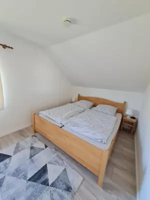 Ein Bett oder Betten in einem Zimmer der Unterkunft Ferienhaus Kleine Robbe