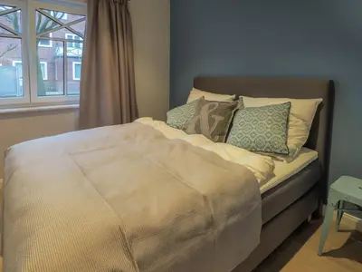 Ein Bett oder Betten in einem Zimmer der Unterkunft Strandpalais Apartment Landgang
