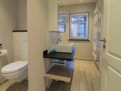 Ein Badezimmer in der Unterkunft Strandpalais Apartment Landgang