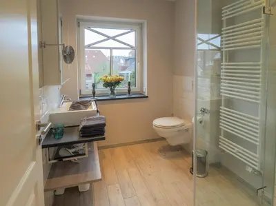 Ein Badezimmer in der Unterkunft Strandpalais Apartment Kajüte