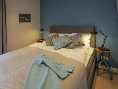 Ein Bett oder Betten in einem Zimmer der Unterkunft Strandpalais Apartment Kajüte