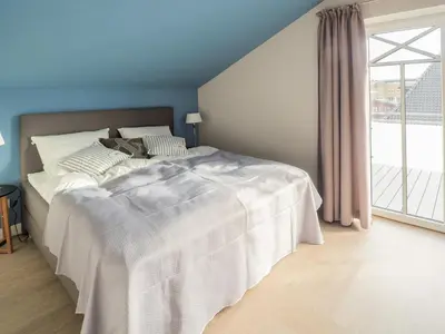 Ein Bett oder Betten in einem Zimmer der Unterkunft Strandpalais Apartment Ausguck