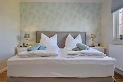 Ein Bett oder Betten in einem Zimmer der Unterkunft Buhne 11