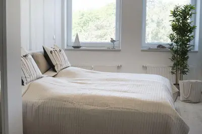 Ein Bett oder Betten in einem Zimmer der Unterkunft Nordseebrandung FeWo B3 4