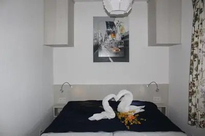 Ein Bett oder Betten in einem Zimmer der Unterkunft Haus Seehund FeWo 16