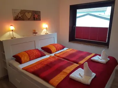 Ein Bett oder Betten in einem Zimmer der Unterkunft Kleine Nixe Hummer