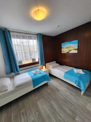 Ein Bett oder Betten in einem Zimmer der Unterkunft Kleine Nixe Kleine Brise