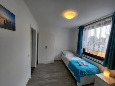 Ein Bett oder Betten in einem Zimmer der Unterkunft Kleine Nixe Kleine Brise