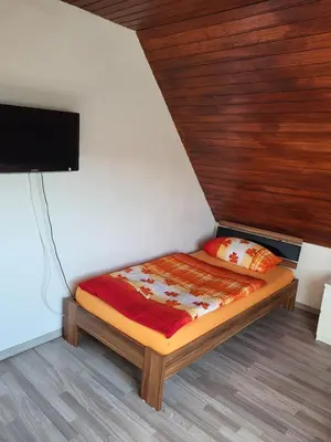 Ein Bett oder Betten in einem Zimmer der Unterkunft Kleine Nixe Seestern