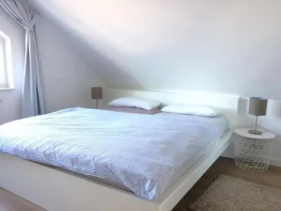 Ein Bett oder Betten in einem Zimmer der Unterkunft Nordseedüne, Ferienwohnung 11