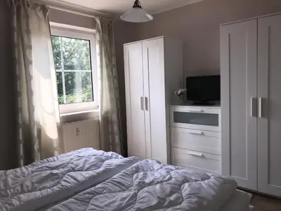 Ein Bett oder Betten in einem Zimmer der Unterkunft Nordseedüne, Ferienwohnung 5