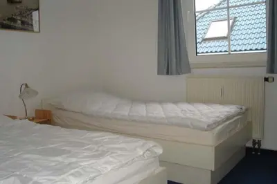 Ein Bett oder Betten in einem Zimmer der Unterkunft Nordseedüne, Ferienwohnung 5