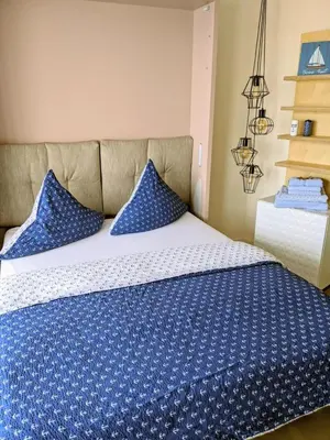 Ein Bett oder Betten in einem Zimmer der Unterkunft Seehütte Ferienwohnung 507
