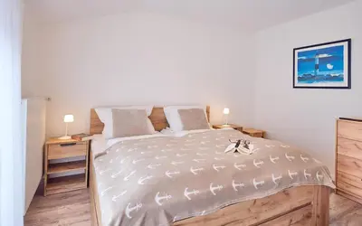 Ein Bett oder Betten in einem Zimmer der Unterkunft Kampweg 28