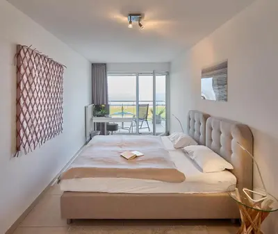Ein Bett oder Betten in einem Zimmer der Unterkunft Düne 1, Ferienwohnung 11